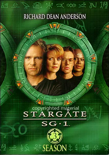 DVD boxset cover for Stargate SG-1 Season 3, showing the cast framed inside the Stargate's inner ring against a green hieroglyph-covered background.
